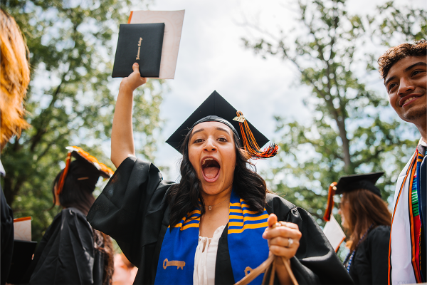 Excited Kalamazoo graduate with diploma