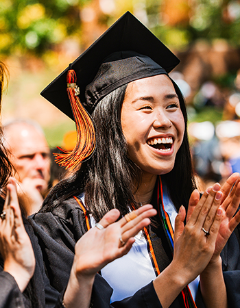 A Kalamazoo College graduate smiling