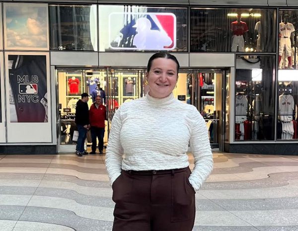 Samantha Moss in front of the Major League Baseball store in New York